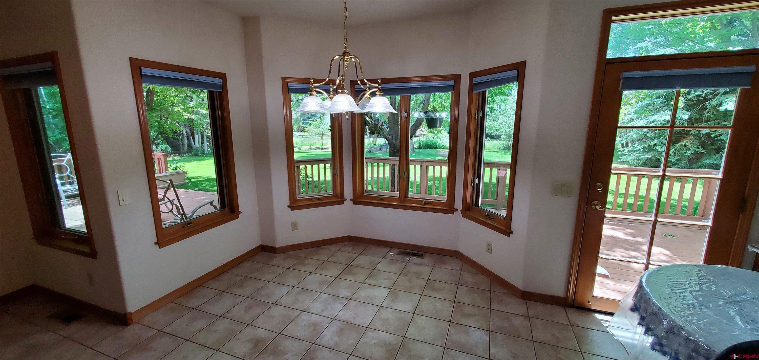 370 Red Rock Road Durango, CO 81301 - Photo 24 of 25 a view of empty room with wooden floor and fan