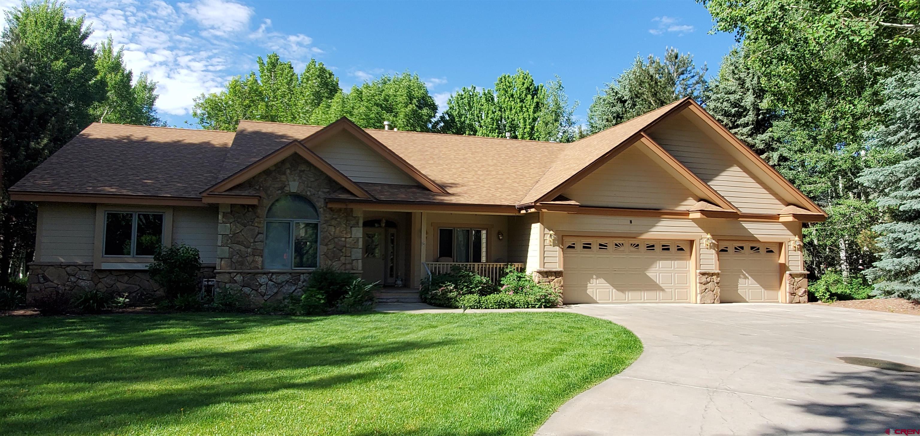 370 Red Rock Road Durango, CO 81301 - Photo 5 of 25 a front view of a house with a yard