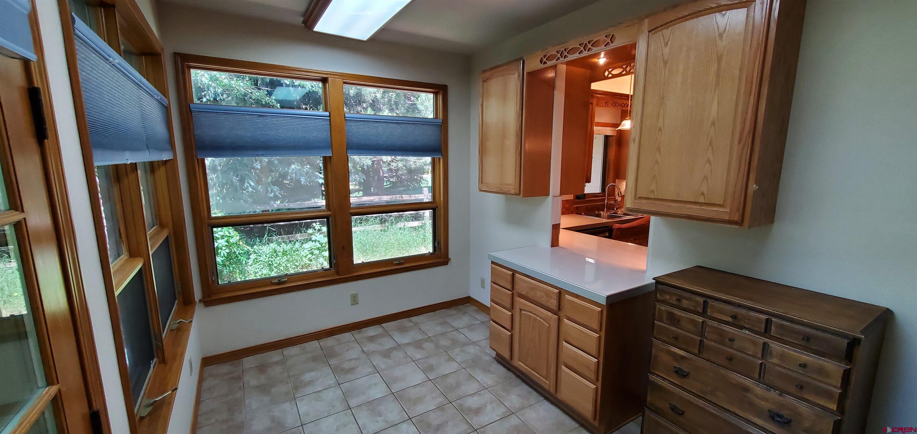 370 Red Rock Road Durango, CO 81301 - Photo 7 of 25 a kitchen with stainless steel appliances granite countertop a refrigerator a sink and a window