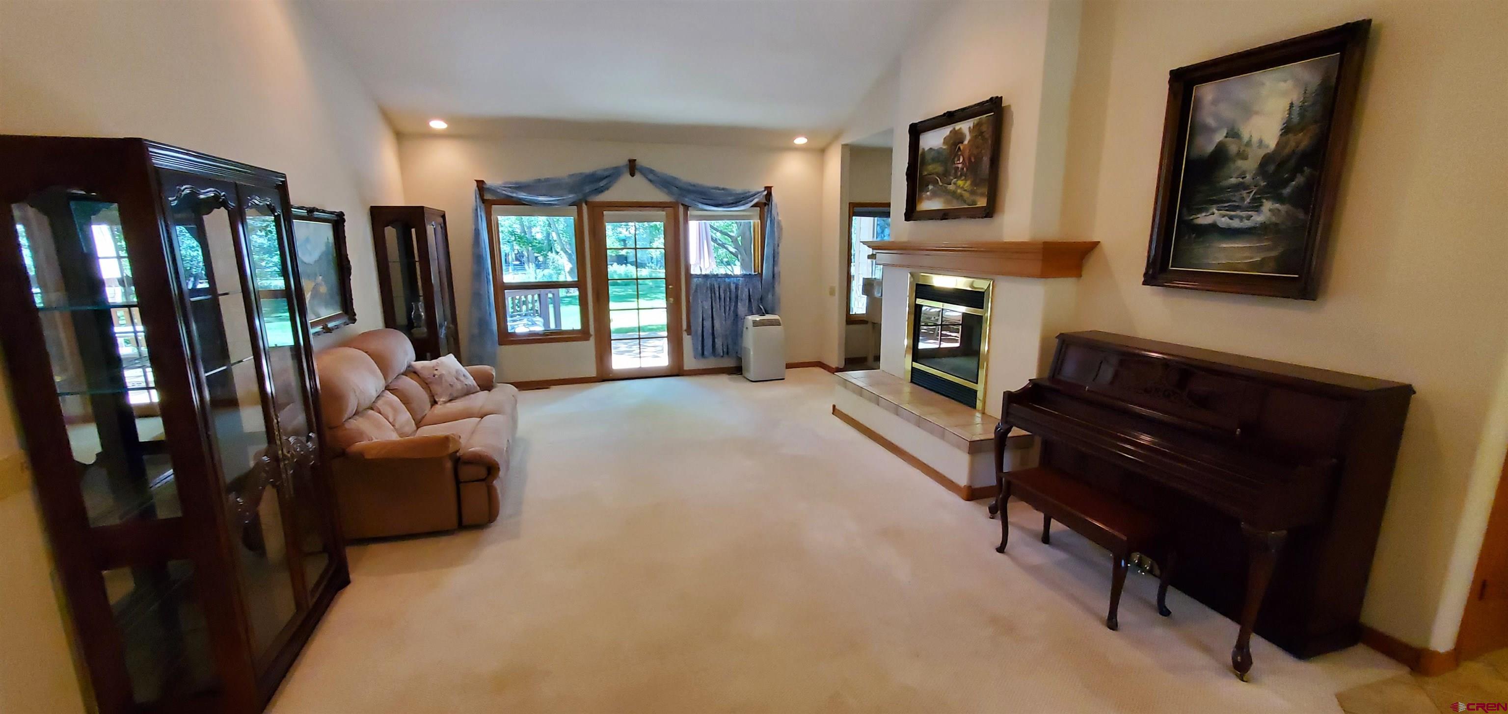 370 Red Rock Road Durango, CO 81301 - Photo 8 of 25 a living room with furniture fireplace and flat screen tv