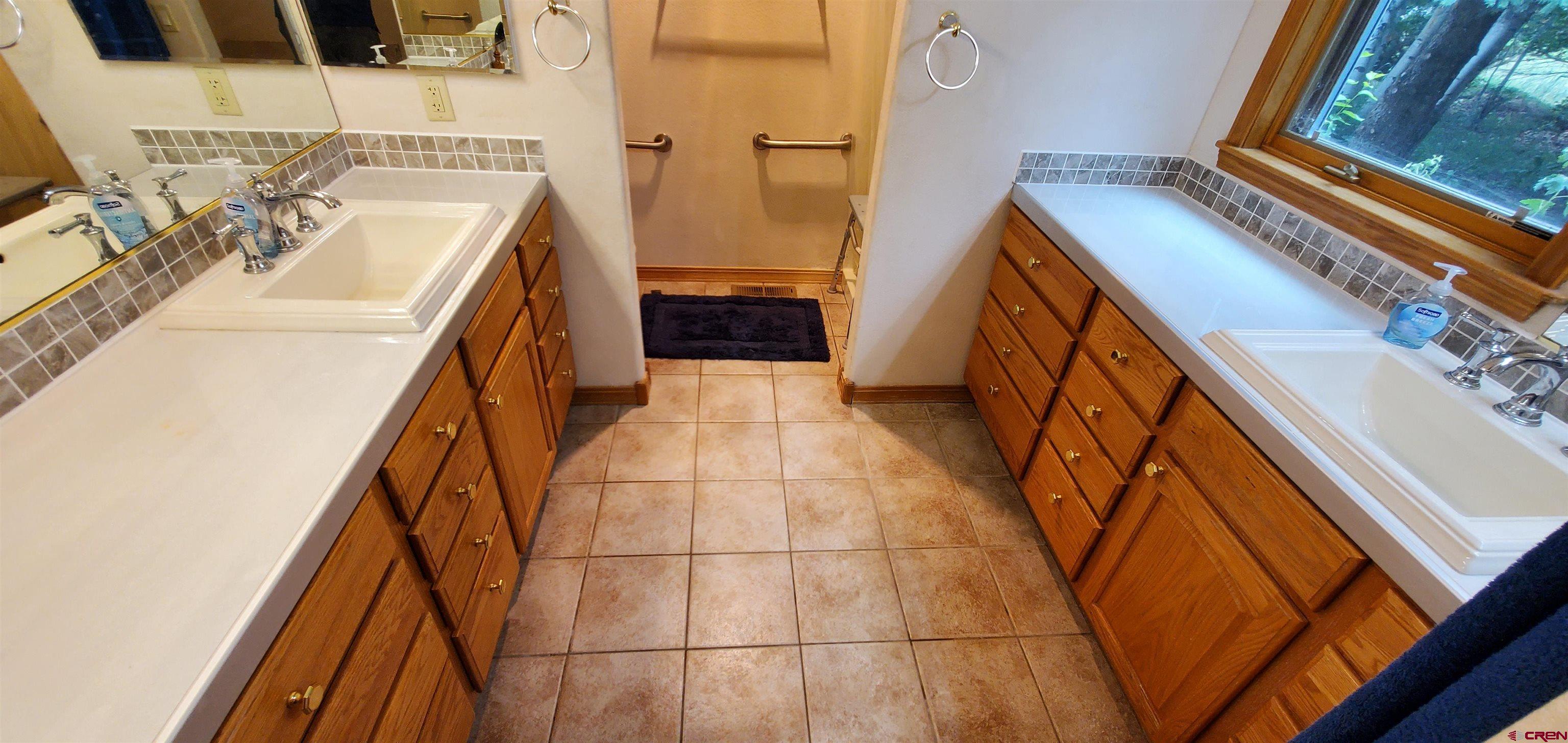 370 Red Rock Road Durango, CO 81301 - Photo 9 of 25 a utility room with dryer and washer