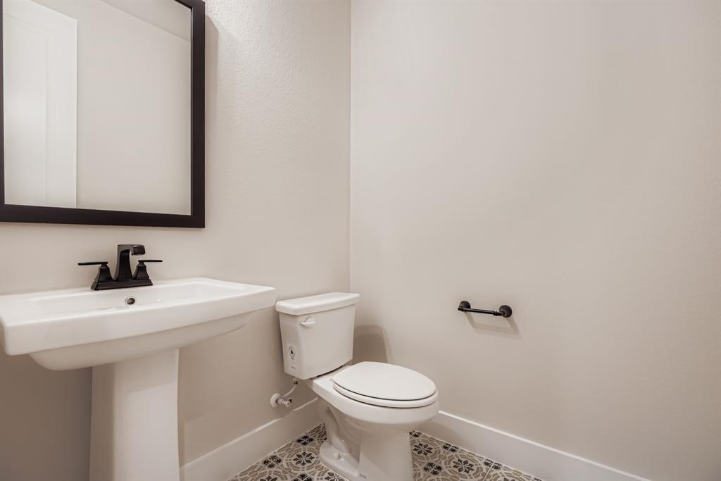 2118 Newhall Road Celina, TX 75009 - Photo 14 of 29 Half bathroom featuring baseboards and tile patterned floors