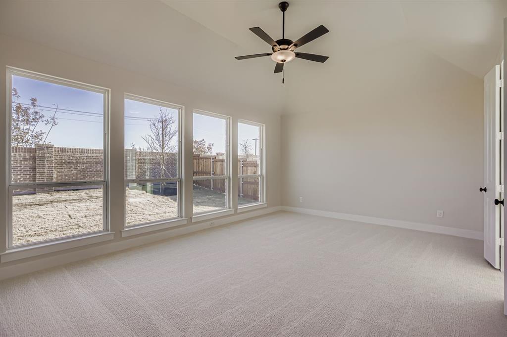 2118 Newhall Road Celina, TX 75009 - Photo 15 of 29 Empty room with lofted ceiling, light colored carpet, and ceiling fan