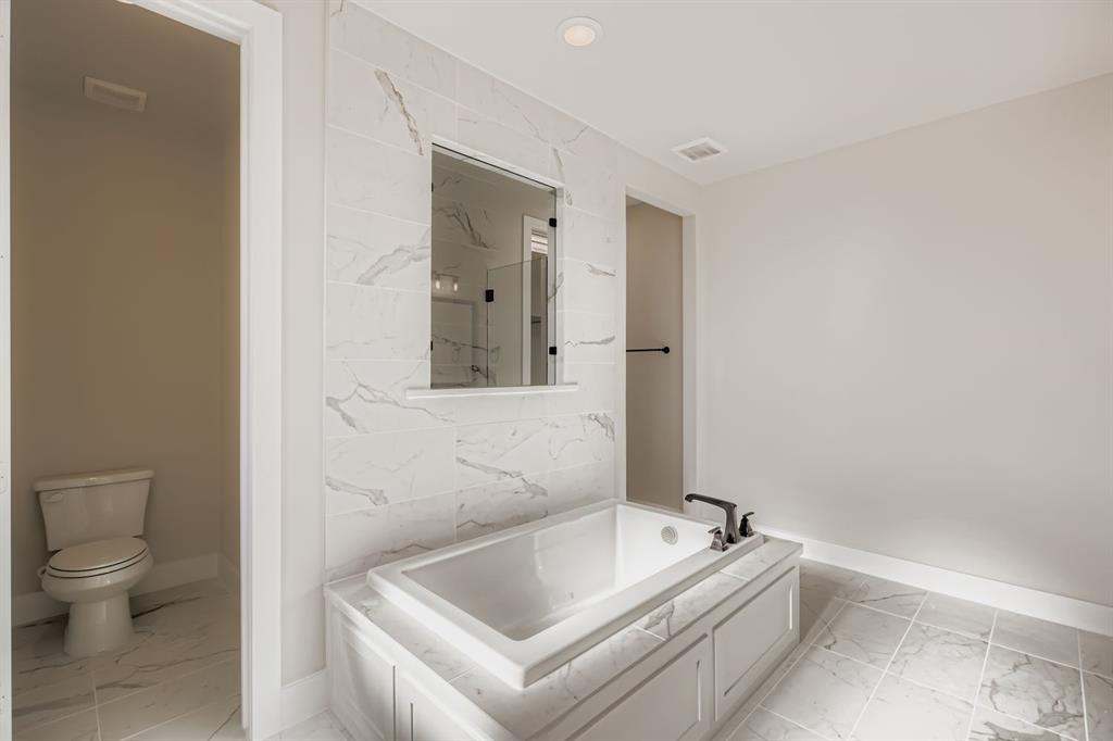 2118 Newhall Road Celina, TX 75009 - Photo 19 of 29 Bathroom with light marble finish flooring and a garden tub