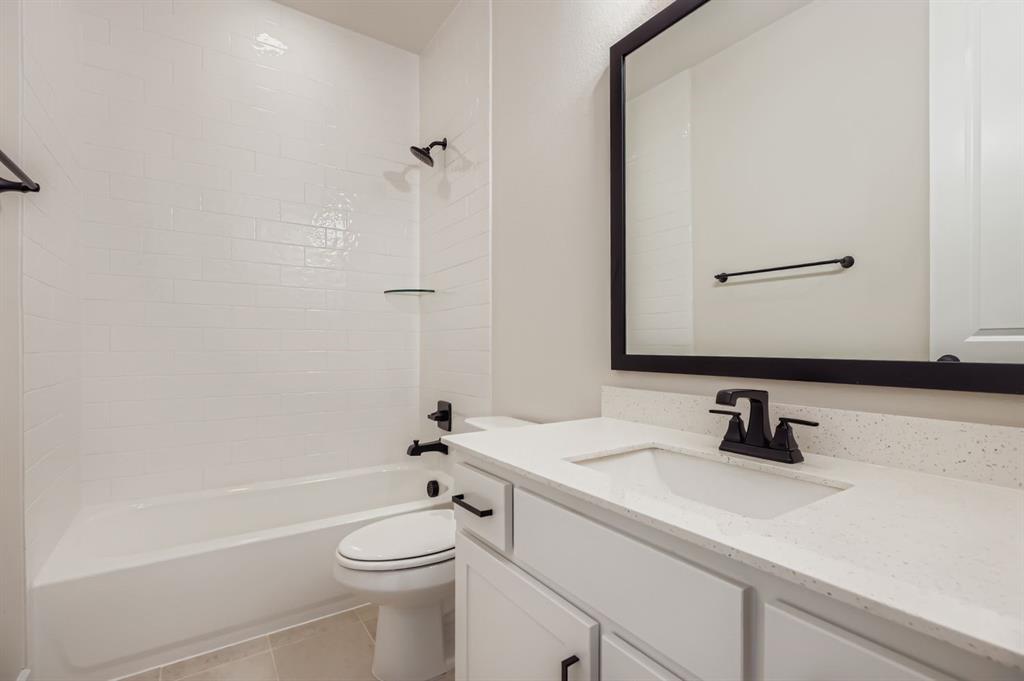 2118 Newhall Road Celina, TX 75009 - Photo 22 of 29 Full bath featuring vanity, shower / bathtub combination, and light tile patterned floors