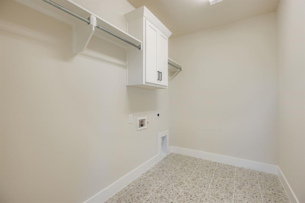 2118 Newhall Road Celina, TX 75009 - Photo 23 of 29 Washroom featuring hookup for an electric dryer, cabinet space, and hookup for a washing machine