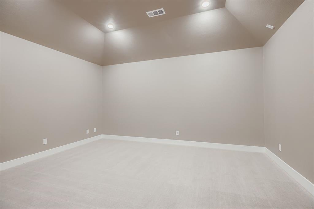 2118 Newhall Road Celina, TX 75009 - Photo 24 of 29 Spare room featuring lofted ceiling, light carpet, and recessed lighting