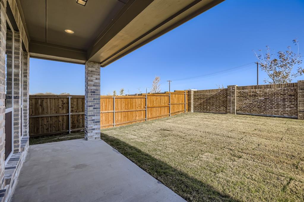 2118 Newhall Road Celina, TX 75009 - Photo 26 of 29 Fenced backyard with a patio area