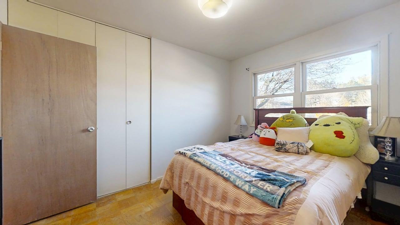 1507 Golfview Road, Unit 1507 Rantoul, IL 61866 - Photo 15 of 24 a bedroom with a bed and wooden floor