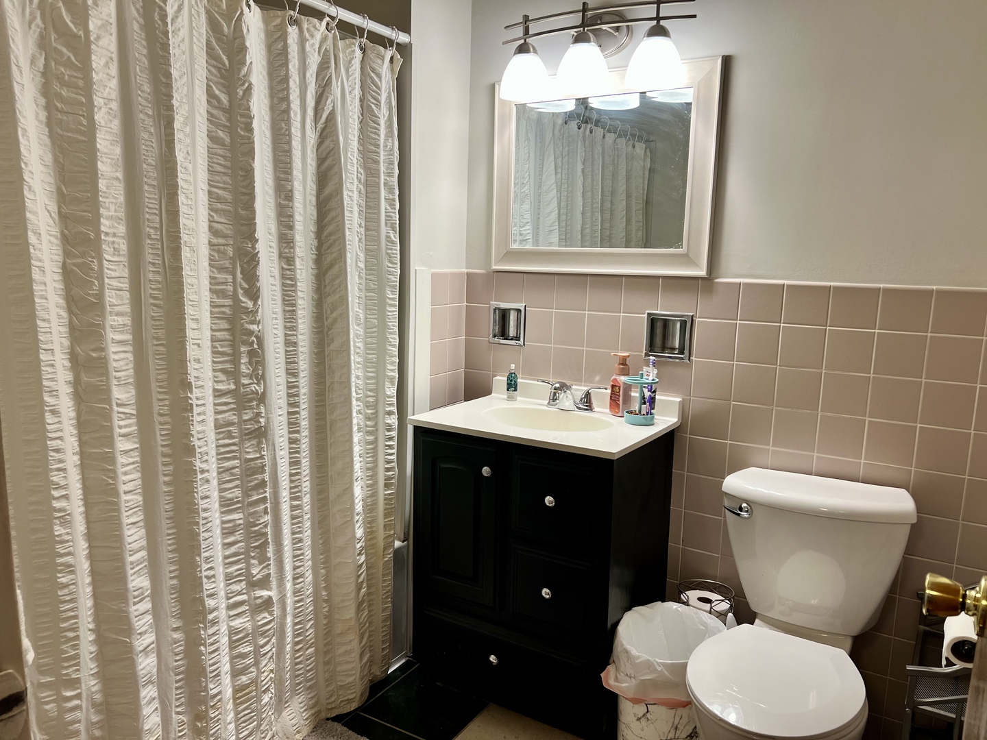 1507 Golfview Road, Unit 1507 Rantoul, IL 61866 - Photo 20 of 24 a bathroom with a toilet sink and mirror