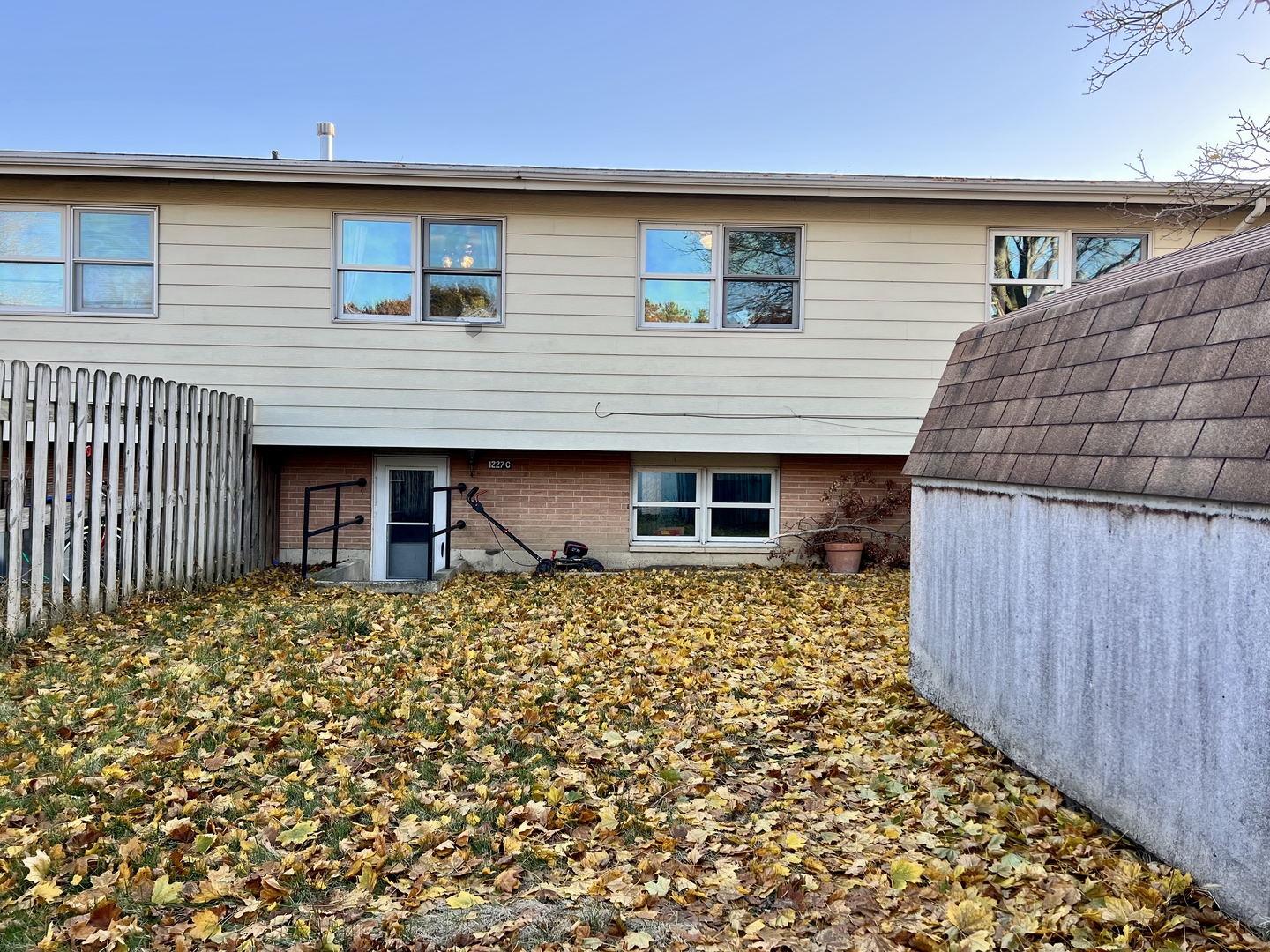 1507 Golfview Road, Unit 1507 Rantoul, IL 61866 - Photo 23 of 24 a front view of a house with a garden