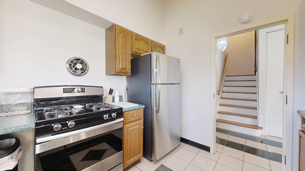 1507 Golfview Road, Unit 1507 Rantoul, IL 61866 - Photo 6 of 24 a kitchen with cabinets and a stove top oven