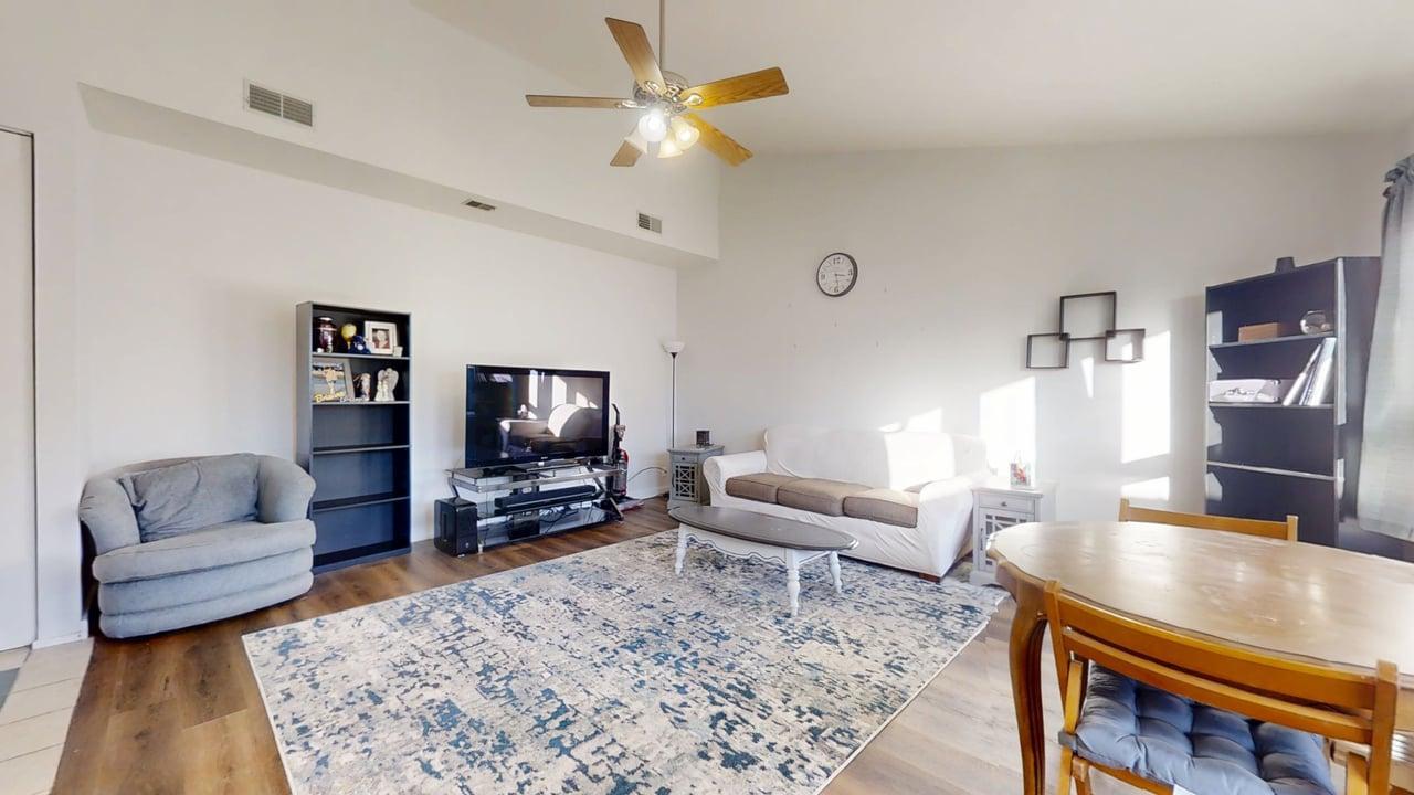 1507 Golfview Road, Unit 1507 Rantoul, IL 61866 - Photo 10 of 24 a living room with furniture and a flat screen tv