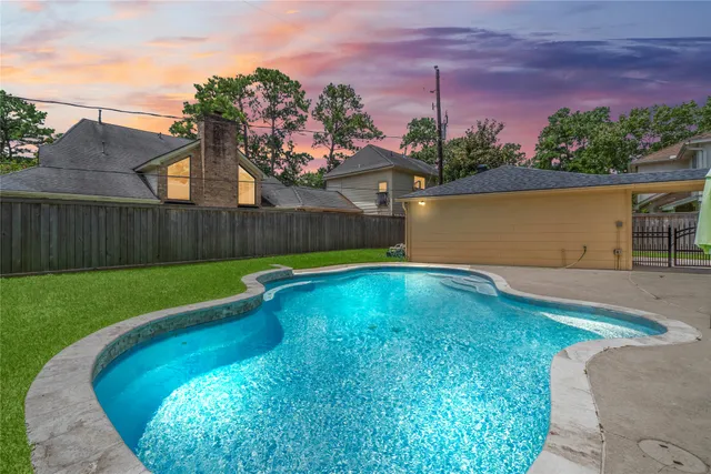 a view of a backyard with a small pool