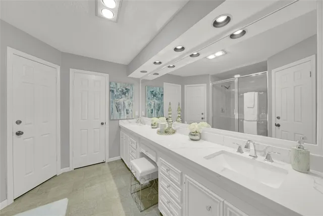 a bathroom with double vanity sinks double vanity and a mirror