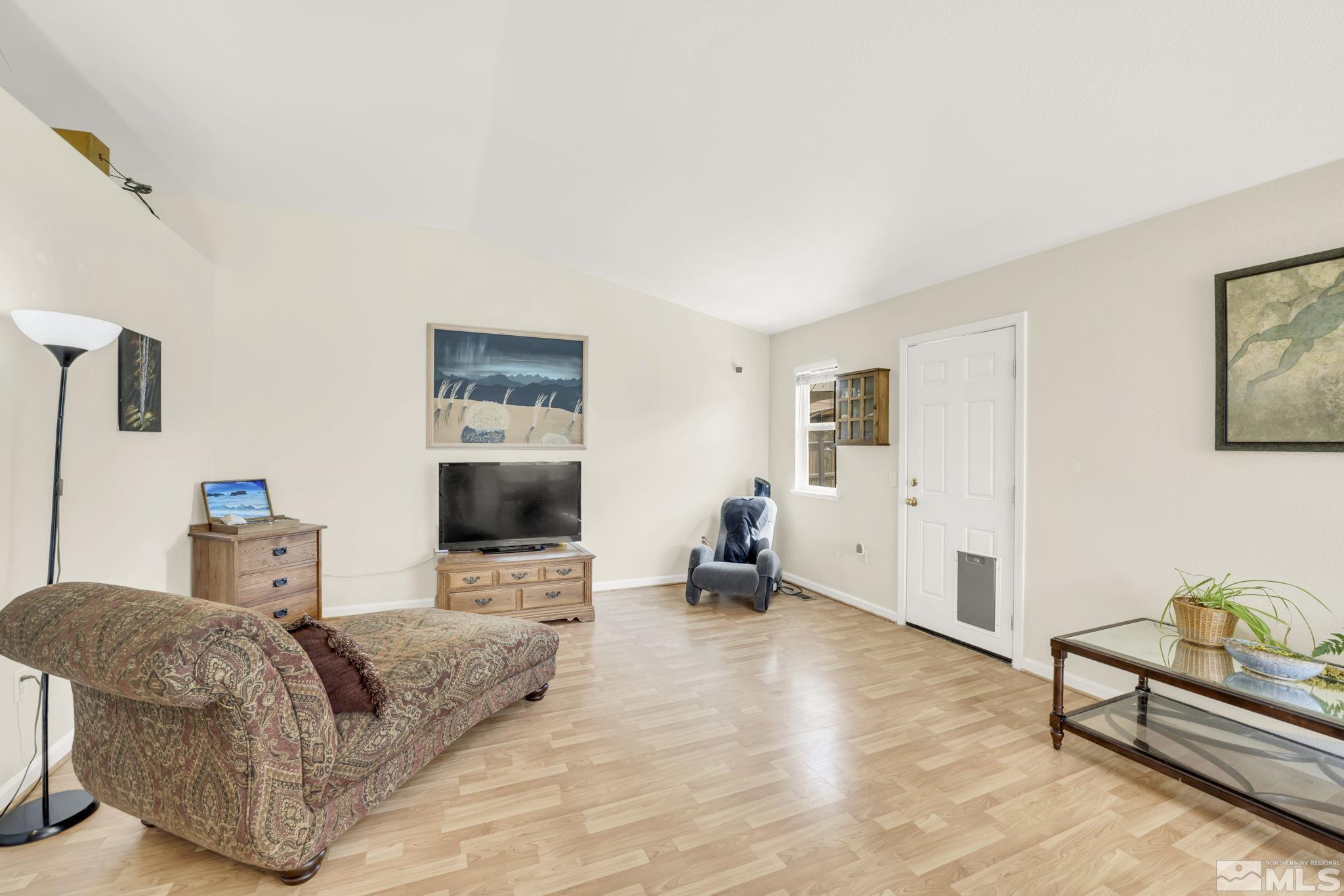 407 Sunshine Lane Fernley, NV 89408 - Photo 14 of 26 a living room with furniture and a flat screen tv