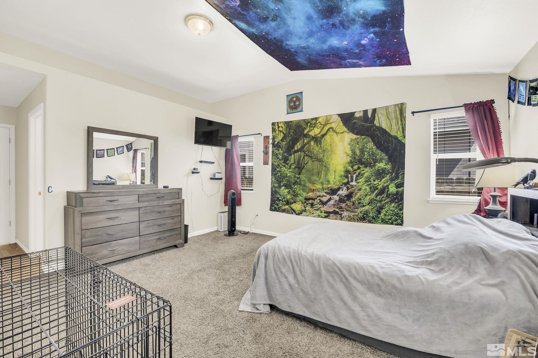 407 Sunshine Lane Fernley, NV 89408 - Photo 22 of 26 a bedroom with a bed and a dresser