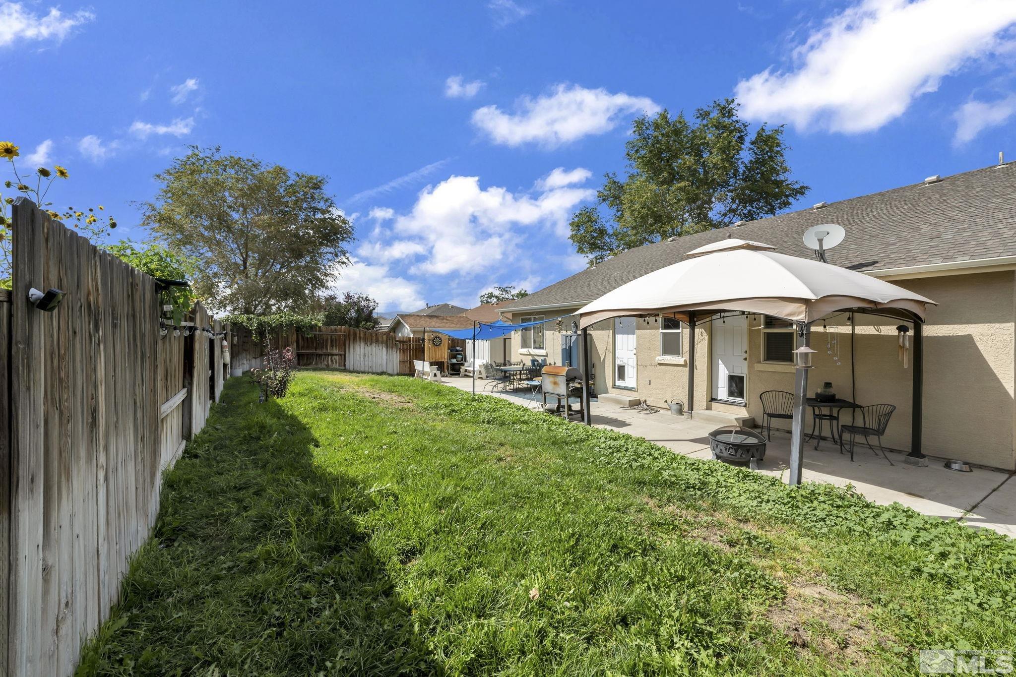 407 Sunshine Lane Fernley, NV 89408 - Photo 26 of 26 a view of a house with backyard and sitting area