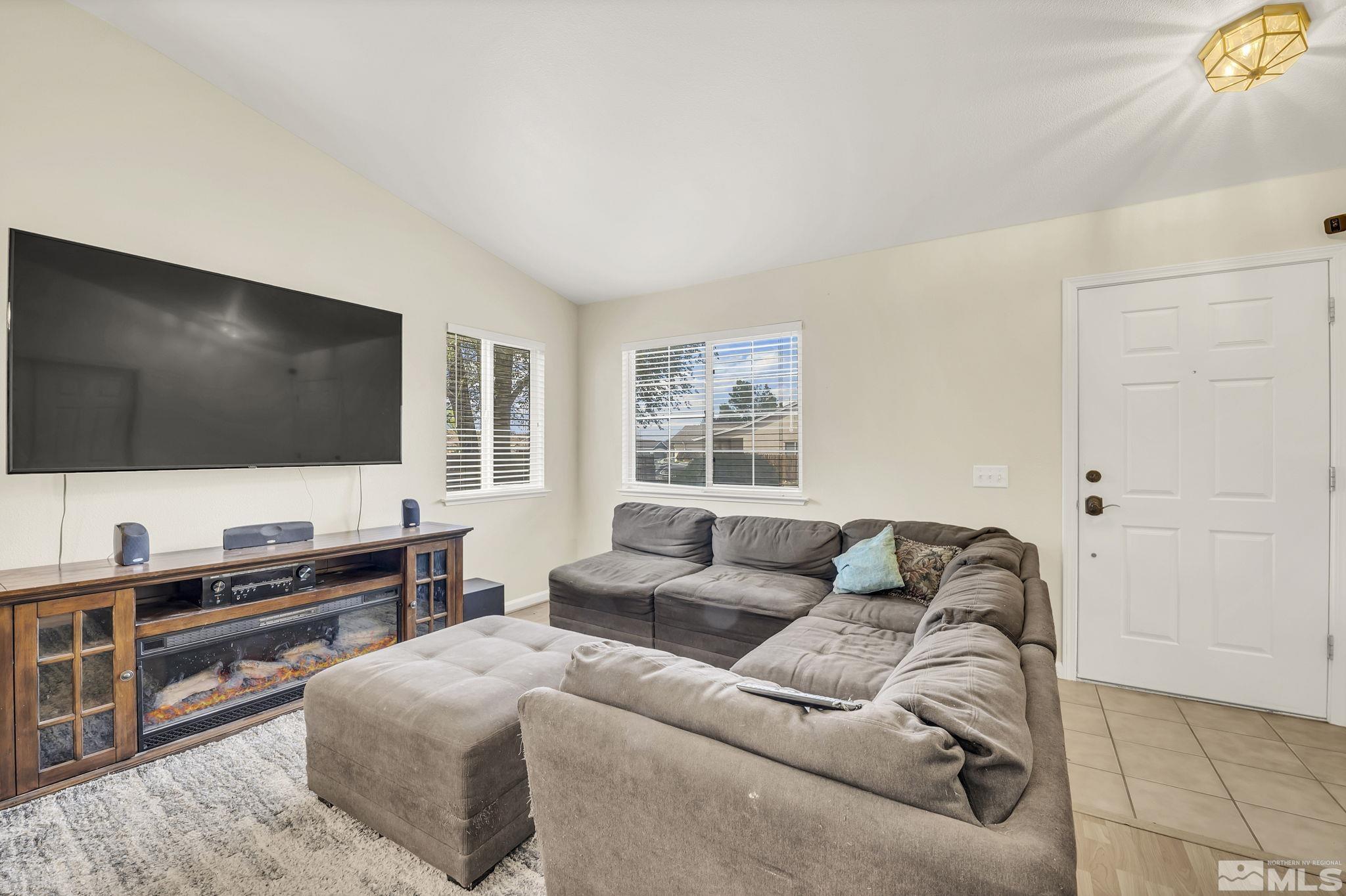 407 Sunshine Lane Fernley, NV 89408 - Photo 5 of 26 a living room with furniture and a flat screen tv