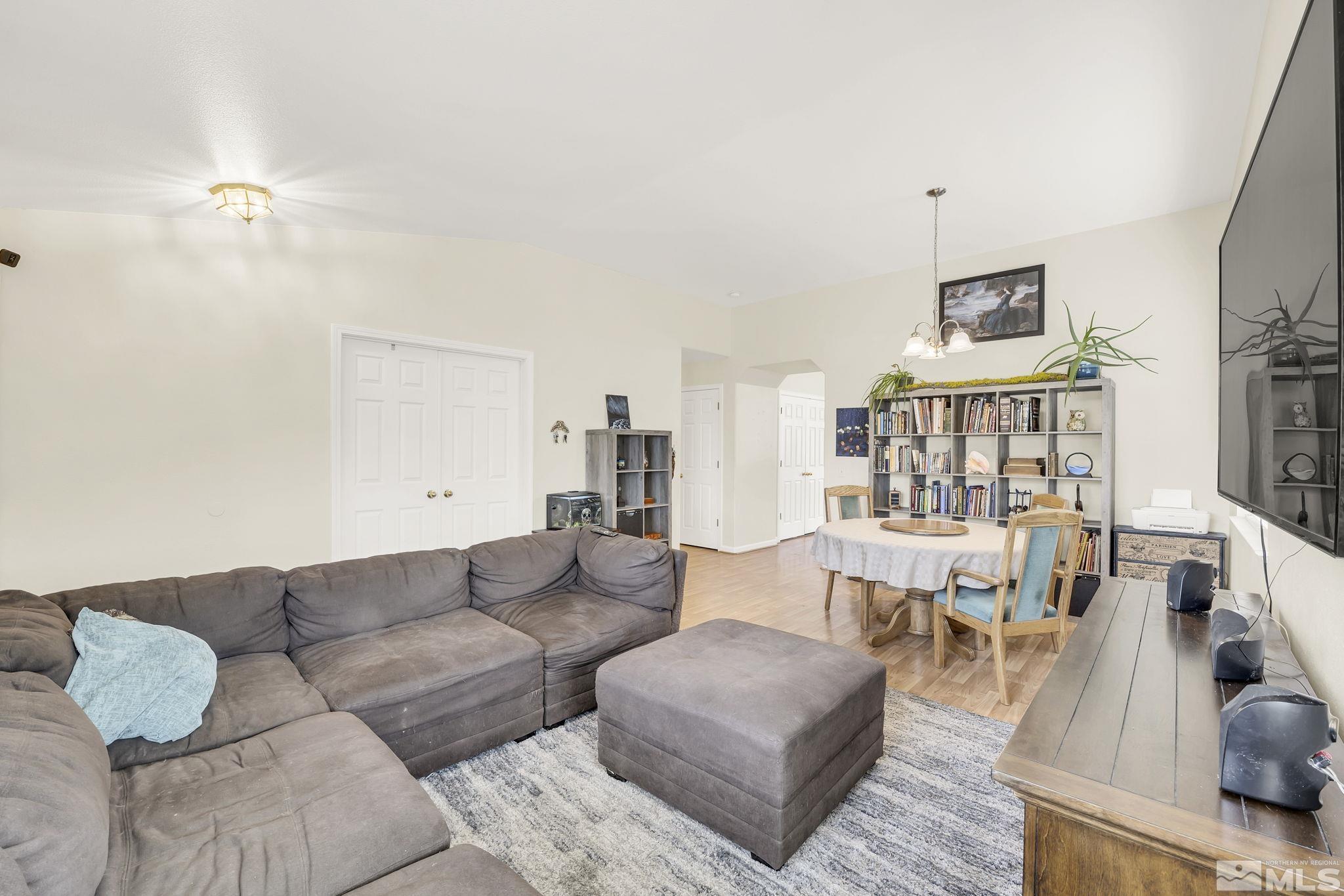407 Sunshine Lane Fernley, NV 89408 - Photo 7 of 26 a living room with furniture and wooden floor