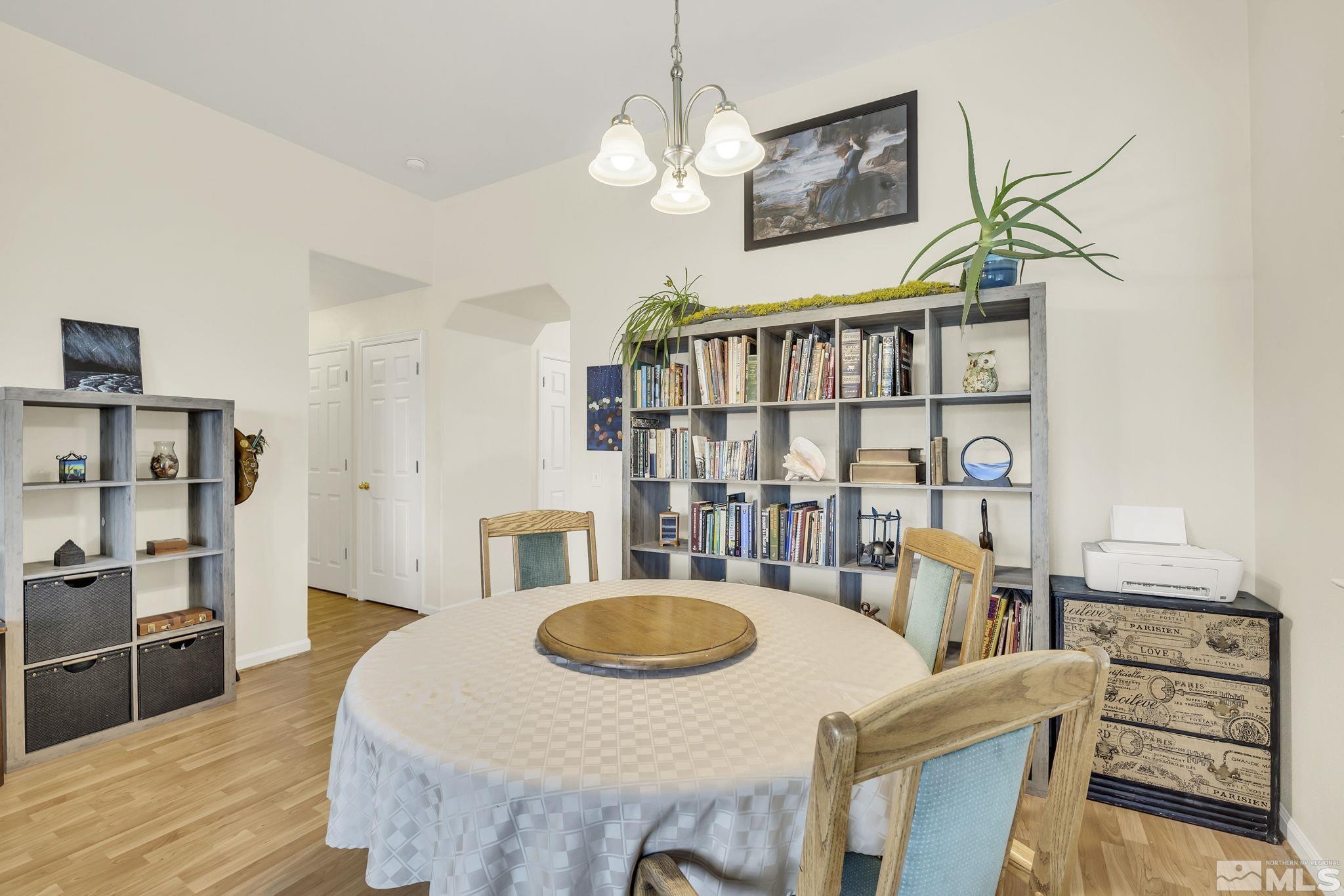 407 Sunshine Lane Fernley, NV 89408 - Photo 9 of 26 a dining room with furniture and wooden floor