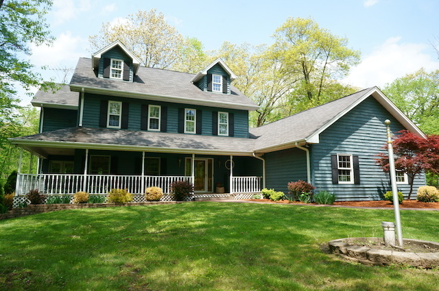 1760 East Burville Road Crete, IL 60417 - Photo 1 of 25 a front view of a house with a garden and plants