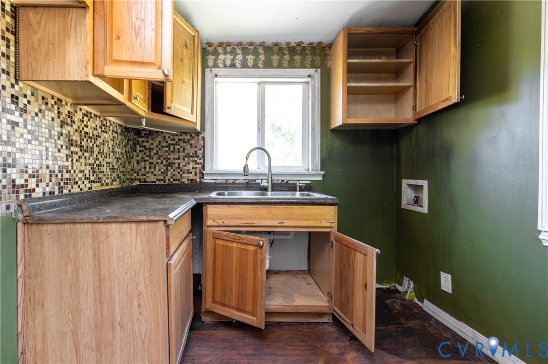 13512 Queen Street Disputanta, VA 23842 - Photo 15 of 46 a kitchen with stainless steel appliances granite countertop a sink and a microwave