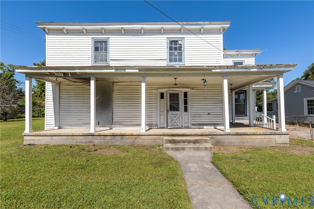 13512 Queen Street Disputanta, VA 23842 - Photo 2 of 46 a front view of a house with a yard