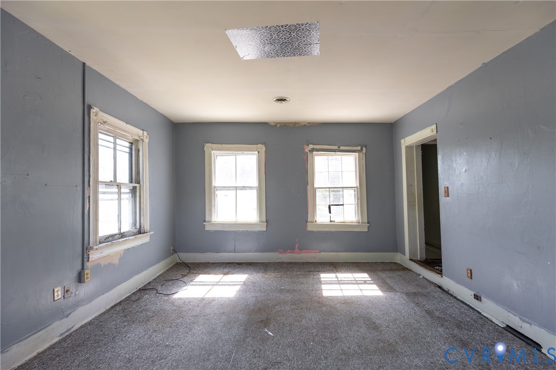 13512 Queen Street Disputanta, VA 23842 - Photo 30 of 46 a view of empty room with windows