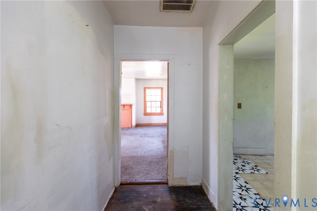 13512 Queen Street Disputanta, VA 23842 - Photo 32 of 46 a view of a bathroom from a hallway