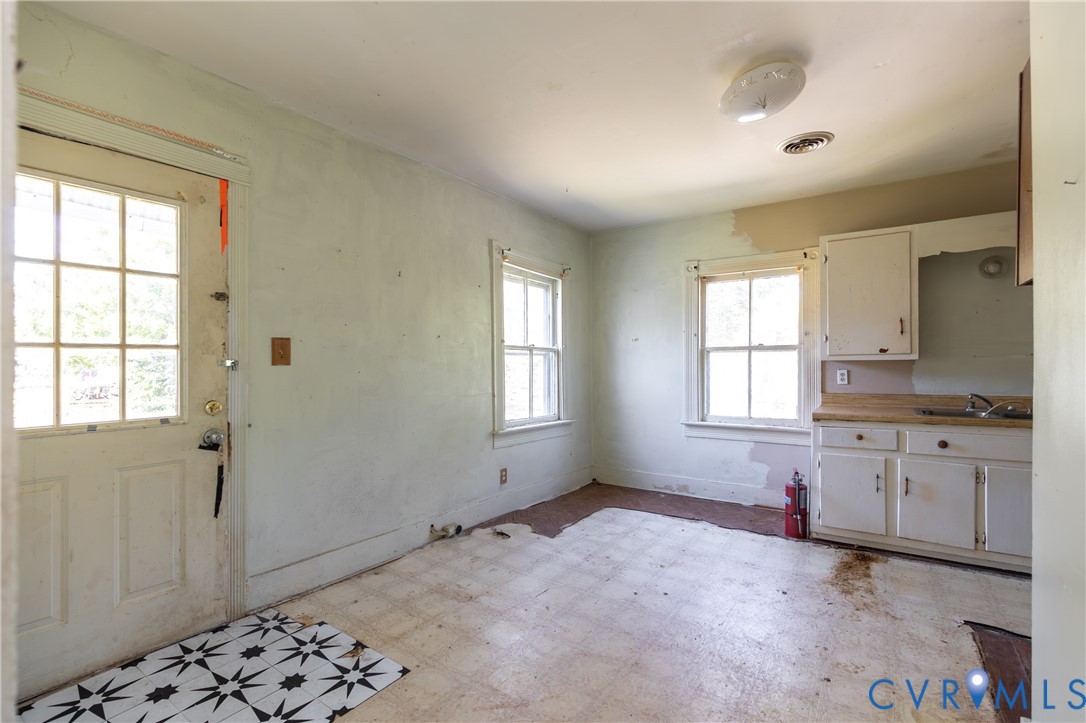 13512 Queen Street Disputanta, VA 23842 - Photo 33 of 46 a room with granite countertop a sink and a window