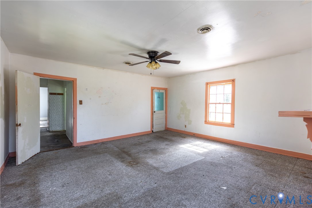 13512 Queen Street Disputanta, VA 23842 - Photo 38 of 46 a view of a room with a ceiling fan and window