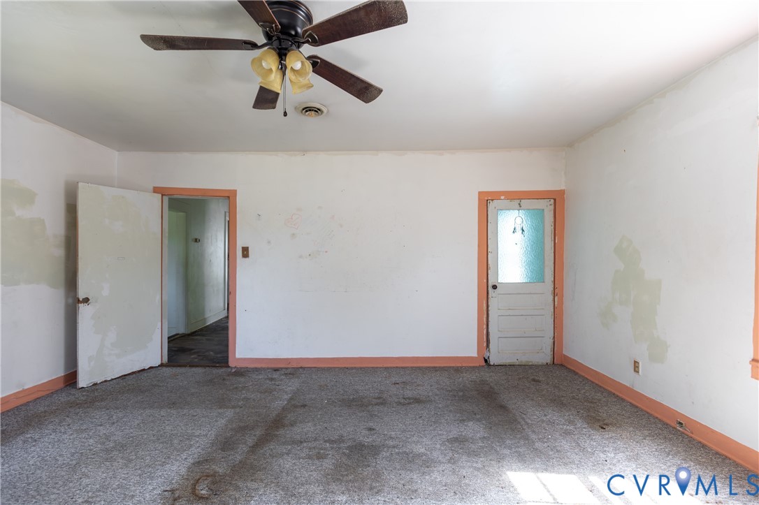 13512 Queen Street Disputanta, VA 23842 - Photo 39 of 46 an empty room with closet and fan