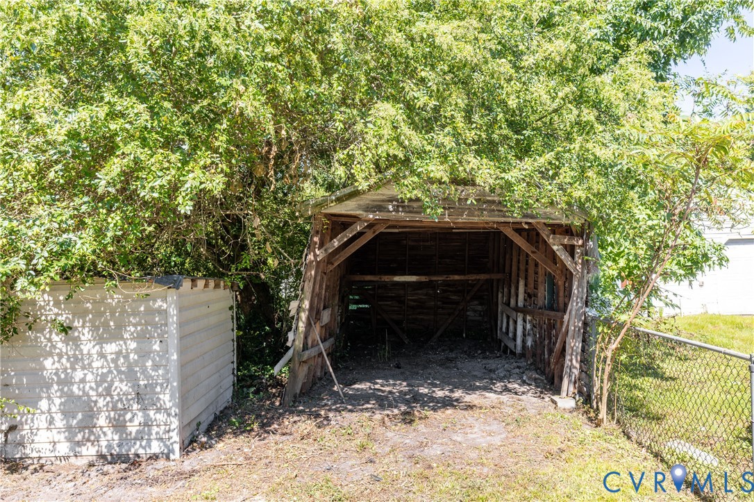 13512 Queen Street Disputanta, VA 23842 - Photo 41 of 46 a view of backyard with a trees
