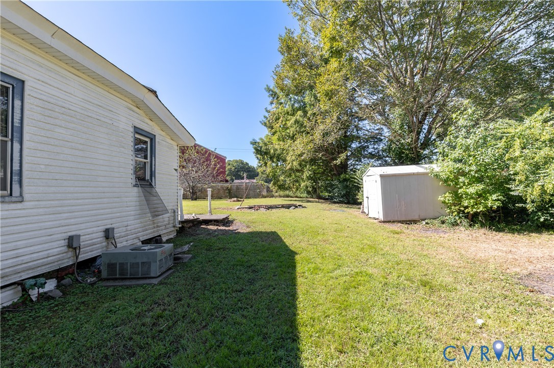 13512 Queen Street Disputanta, VA 23842 - Photo 43 of 46 a view of backyard with swimming pool