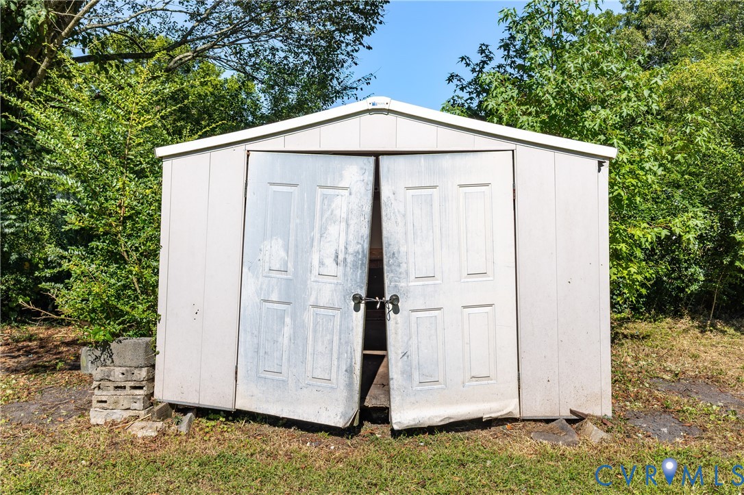13512 Queen Street Disputanta, VA 23842 - Photo 45 of 46 a backyard of a house with an outdoor space