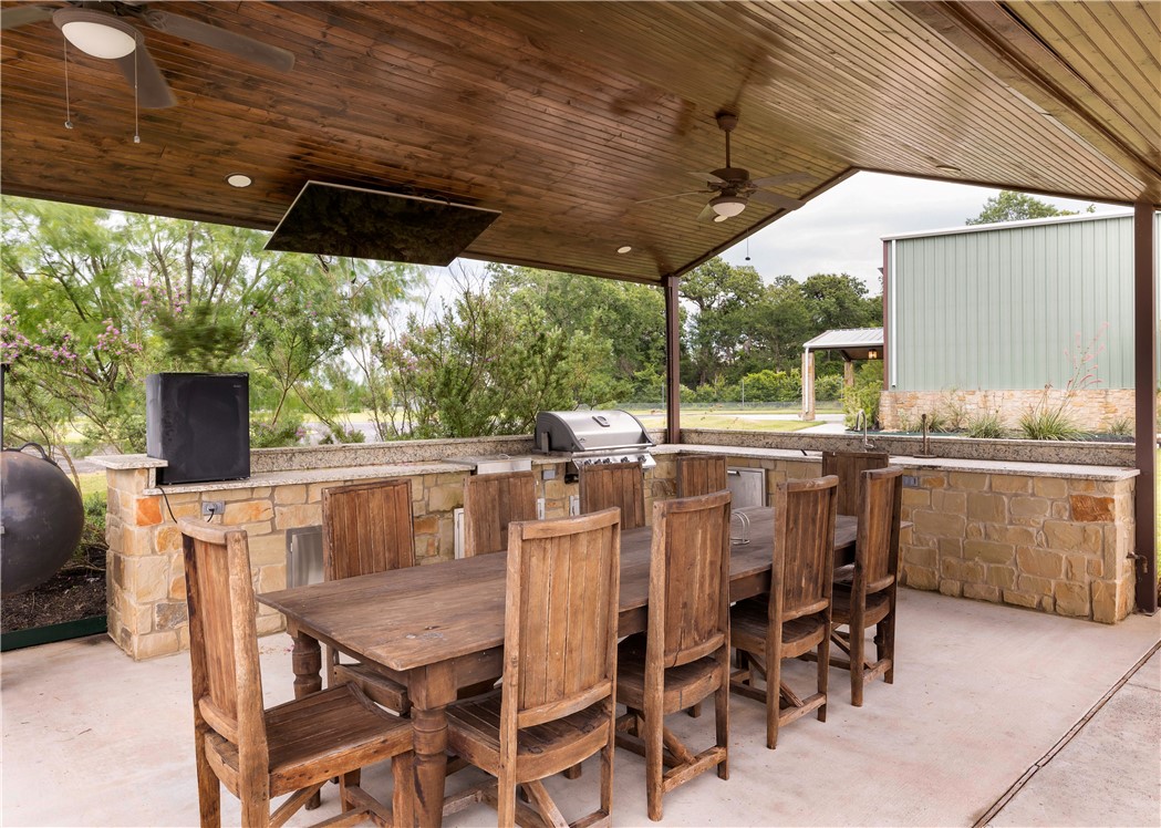 10285 Ferrill Creek Road Bryan, TX 77808 - Photo 15 of 44 a view of an outdoor dining space with a table and chairs