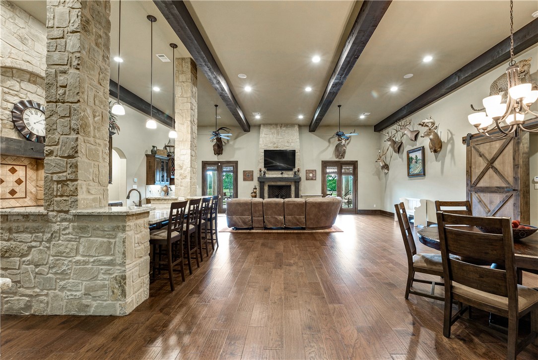 10285 Ferrill Creek Road Bryan, TX 77808 - Photo 17 of 44 a view of a dining area with furniture and wooden floor