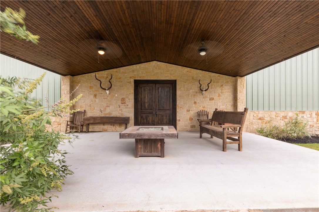 10285 Ferrill Creek Road Bryan, TX 77808 - Photo 27 of 44 a outdoor space with patio furniture and a large window