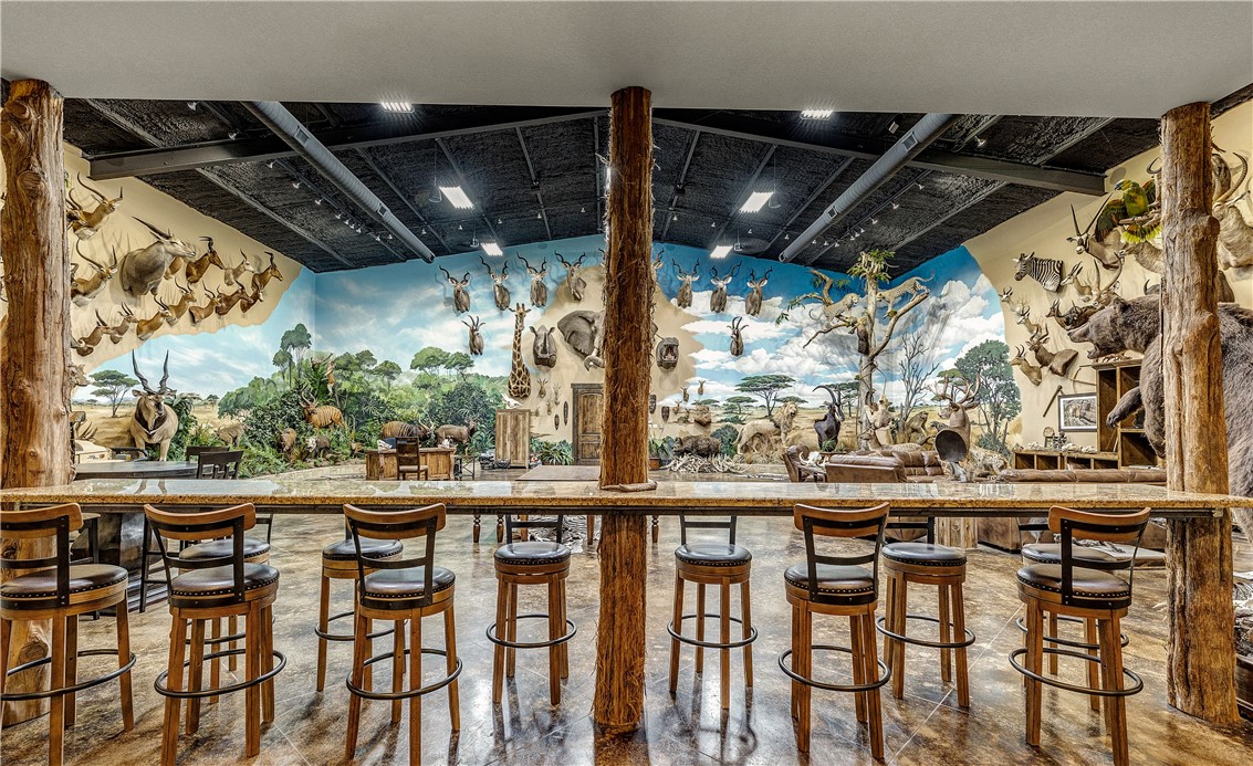 10285 Ferrill Creek Road Bryan, TX 77808 - Photo 31 of 44 a view of a chairs and table in the patio