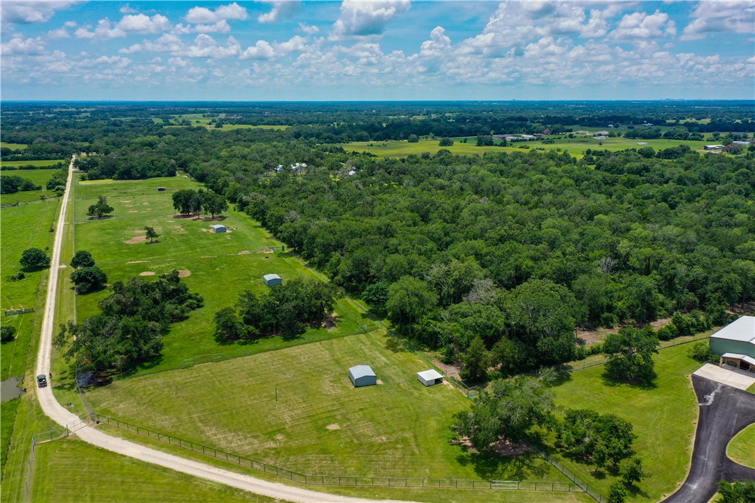 10285 Ferrill Creek Road Bryan, TX 77808 - Photo 38 of 44 a view of a back yard of a green field
