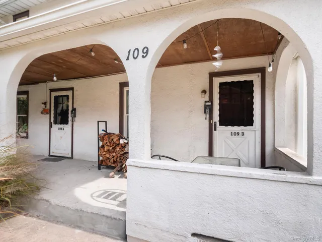 a view of a balcony a door and wooden floor