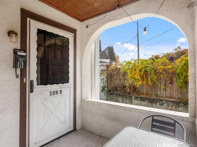 a view of entryway with wooden floor and stairs