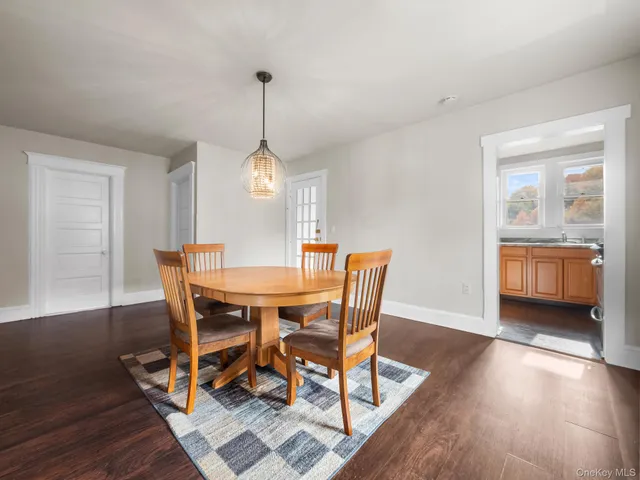 a kitchen with a refrigerator and a sink