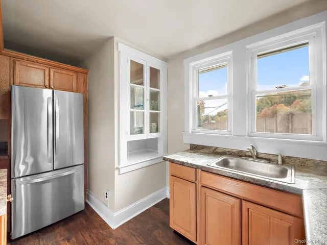 a kitchen with stainless steel appliances granite countertop a stove microwave and sink