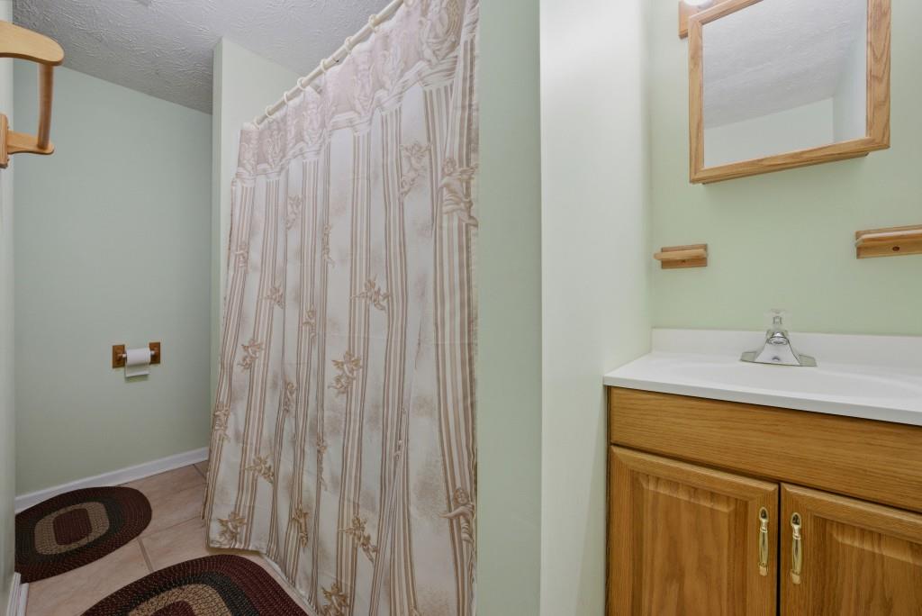 542 Knox Chapel Road Social Circle, GA 30025 - Photo 32 of 52 a bathroom with a sink and a mirror