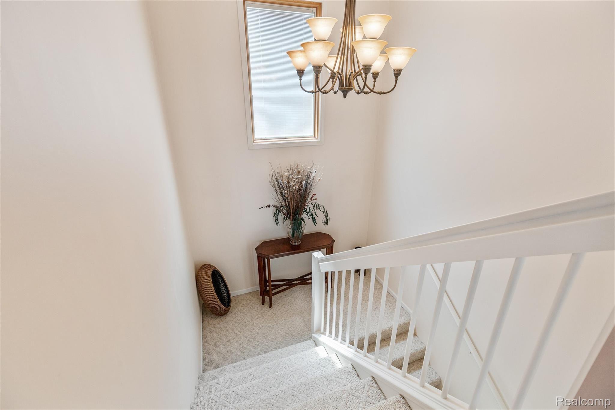 7784 Tipsico Lake Road Holly, MI 48442 - Photo 25 of 55 Staircase view from upper level