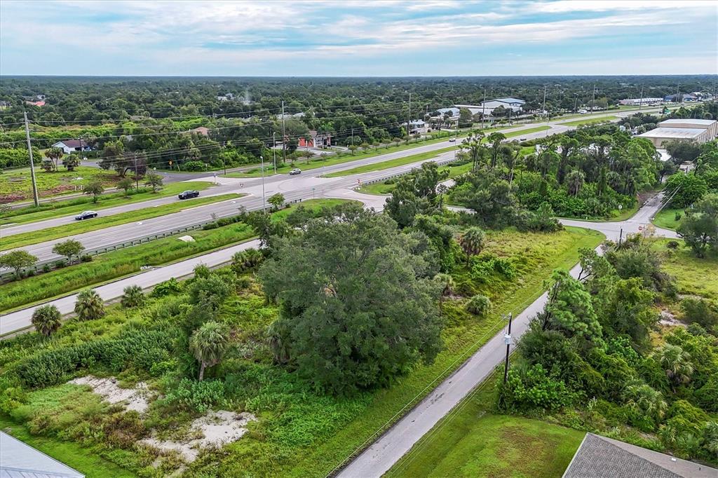 3285 South Access Road Englewood, FL 34224 - Photo 14 of 20 an aerial view of a city with lots of green space