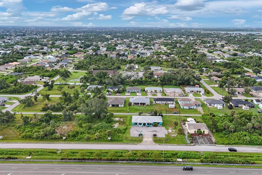 3285 South Access Road Englewood, FL 34224 - Photo 20 of 20 an aerial view of residential houses with outdoor space and street view