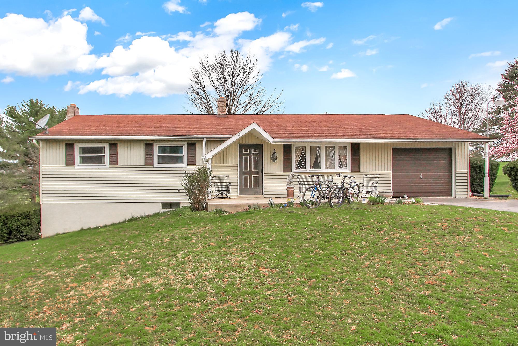 235 Dull Road Felton, PA 17322 - Photo 5 of 29 a front view of a house with a garden